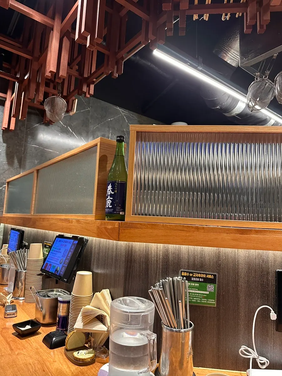 Japanese-style ceiling and bar seating at Mentsuru