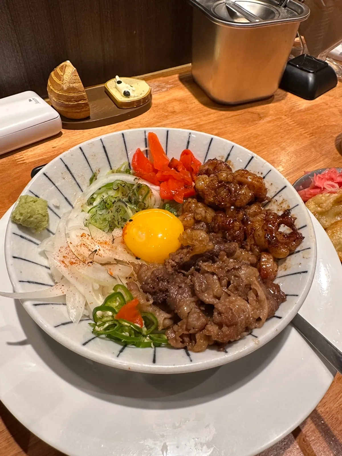 Mentsuru's hormone-don topped with grilled intestine and beef brisket