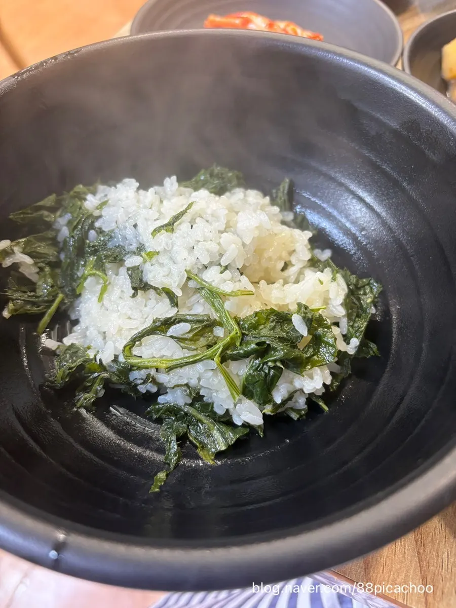 Basic banchan including seasoned greens and braised potatoes