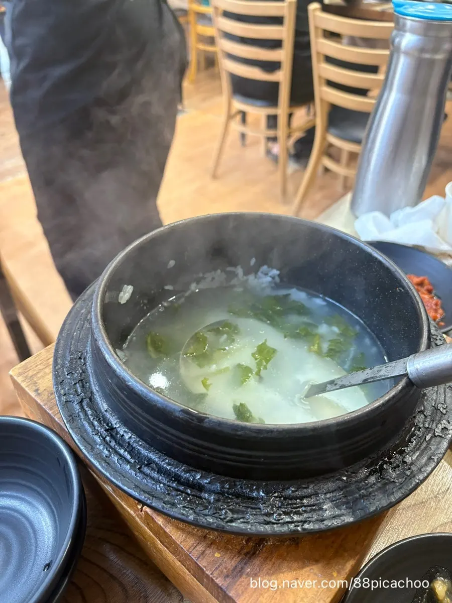 Finishing a hanjeongsik meal of greens, fish, and meat