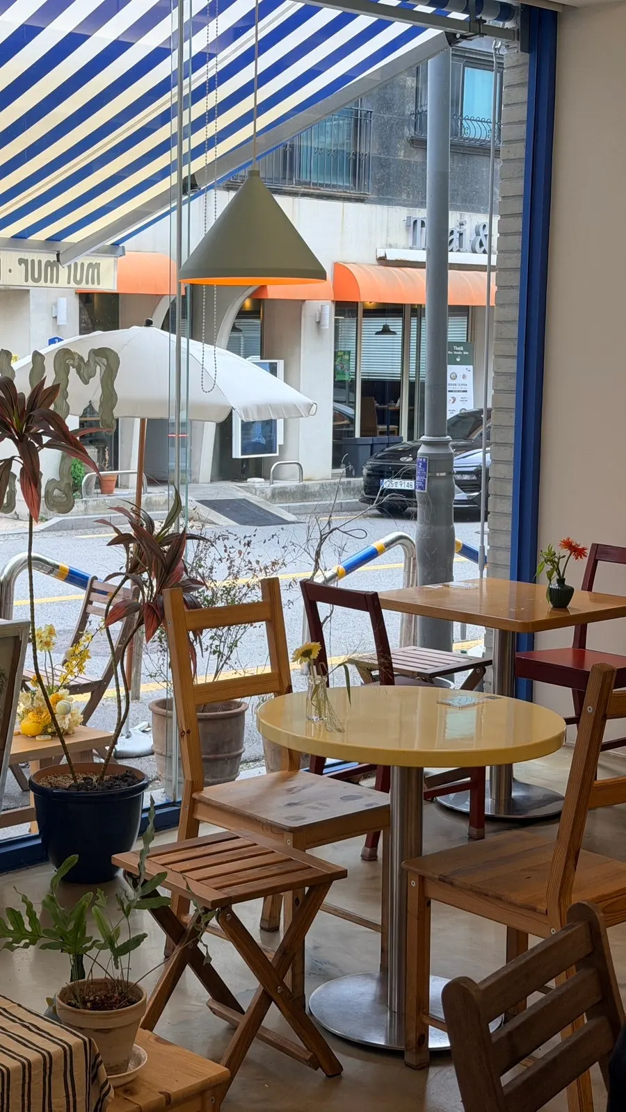 Interior of Meolmeol Pangyo with wood-tone seating and floor-to-ceiling windows