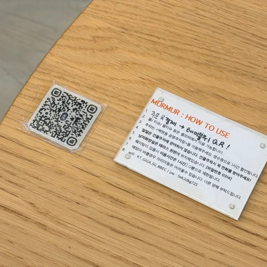 Table sign with QR ordering and self-serve bar instructions