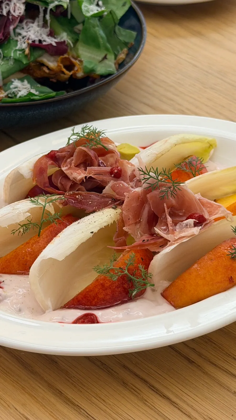 Open sandwich set up with the knife propped so it doesn't touch the table