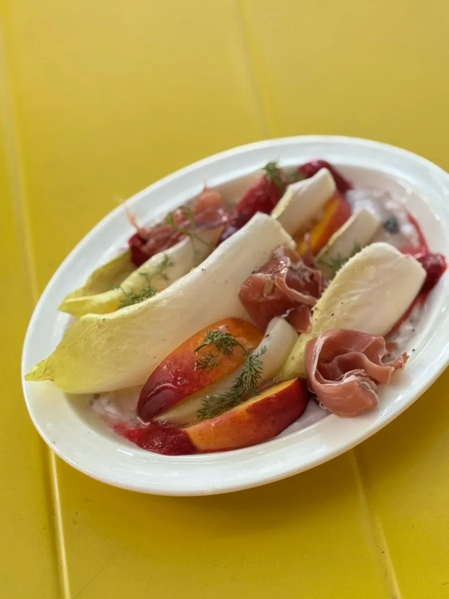 A plate of raspberry endive salad