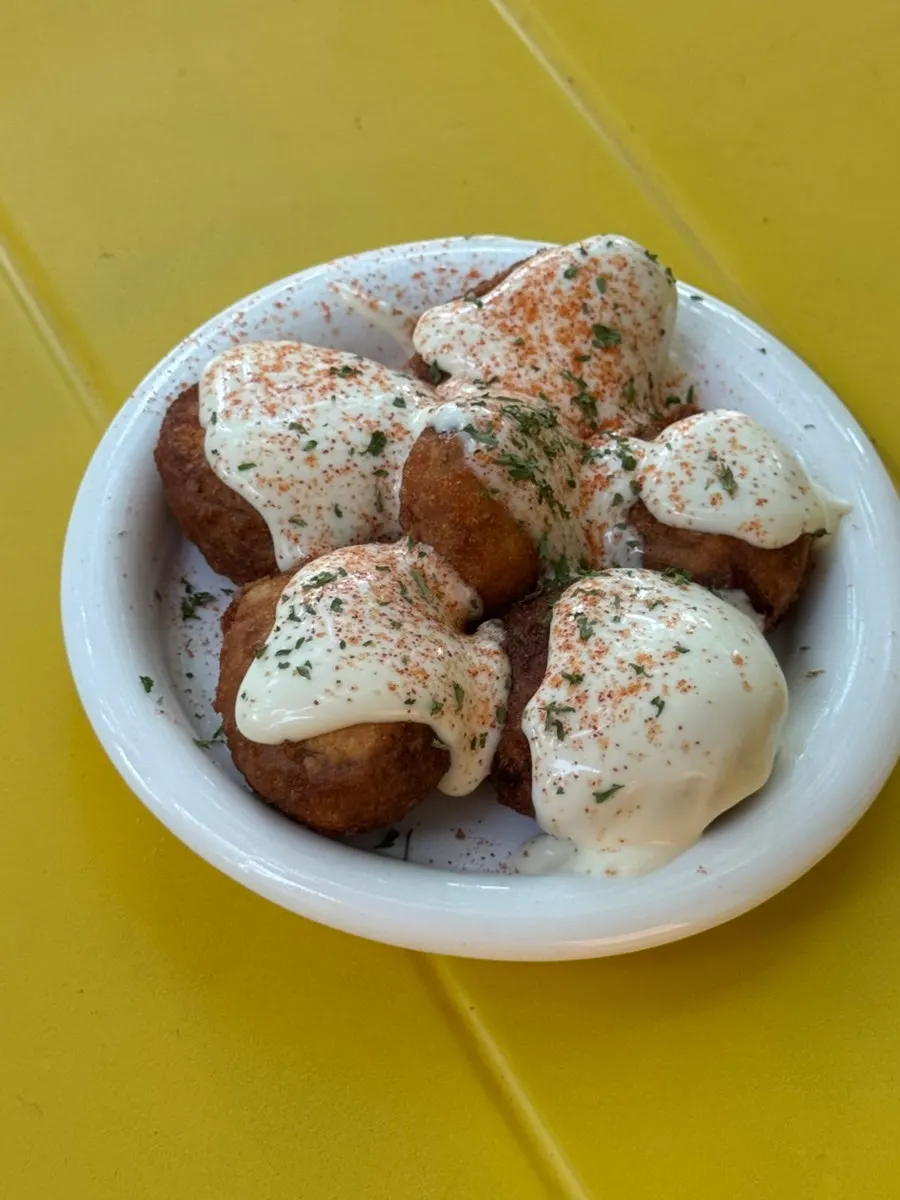 Truffle sauce drizzled over baby potatoes