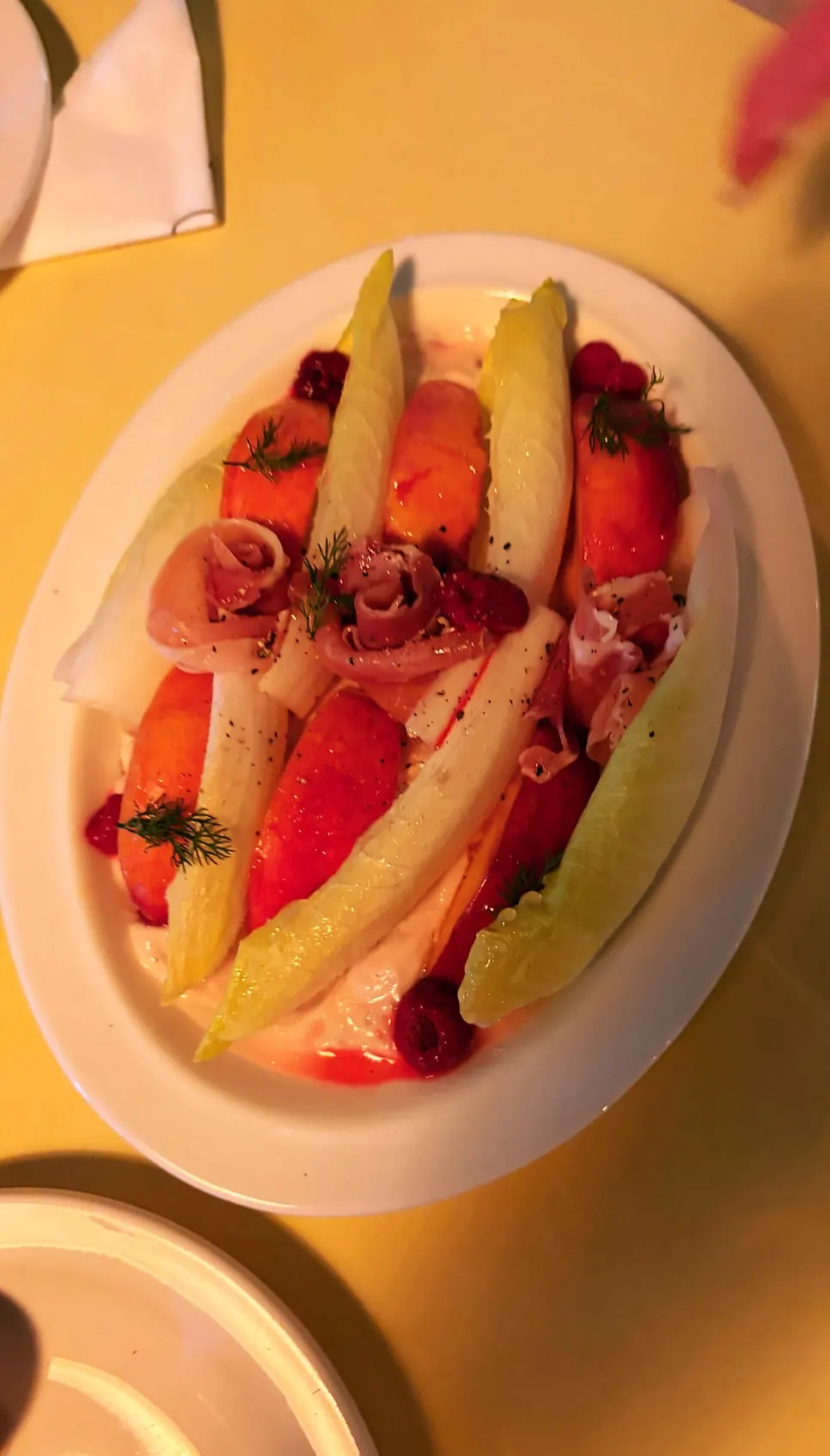 Close-up of the salad with jamón, peach and Greek yogurt