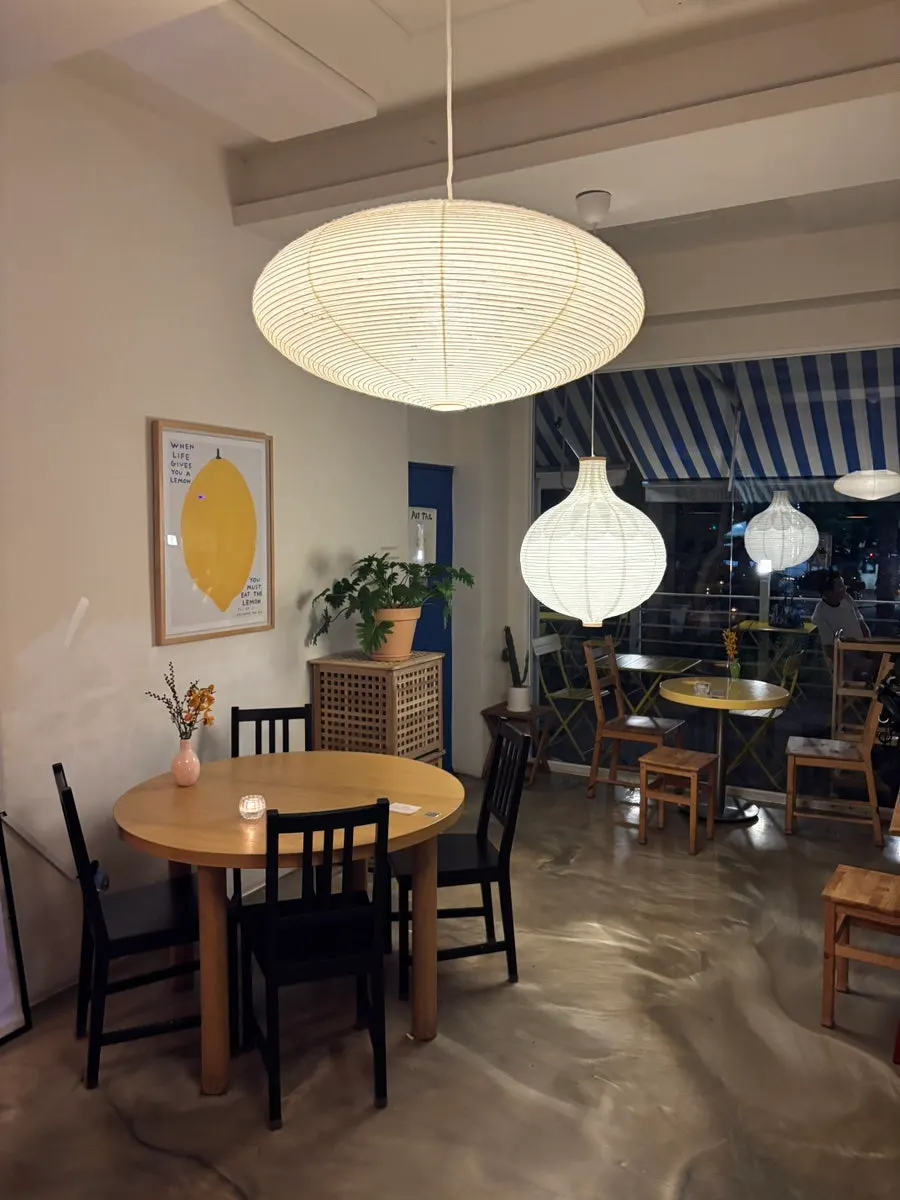 Interior of Meolmeol Pangyo with wood-toned tables and chairs