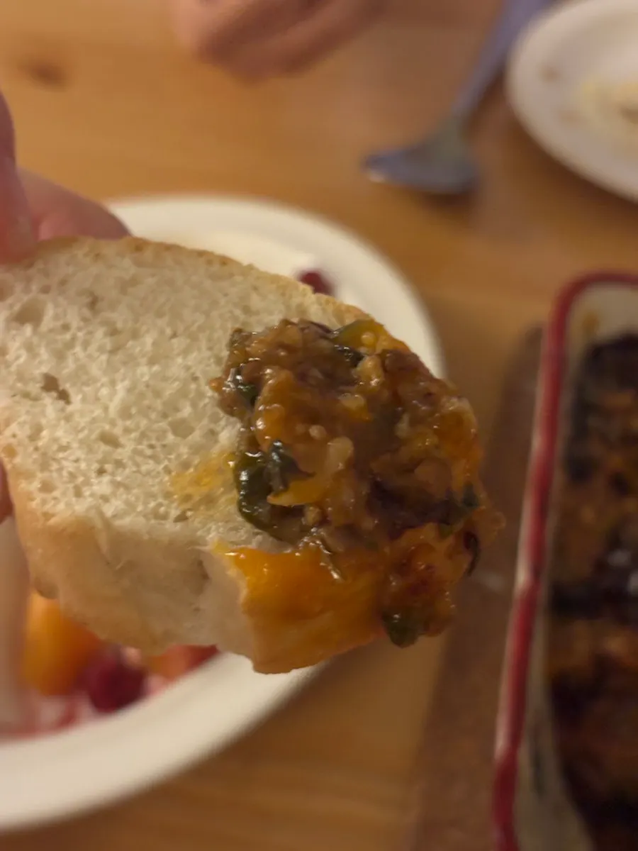 Baguette dipped in lasagna sauce