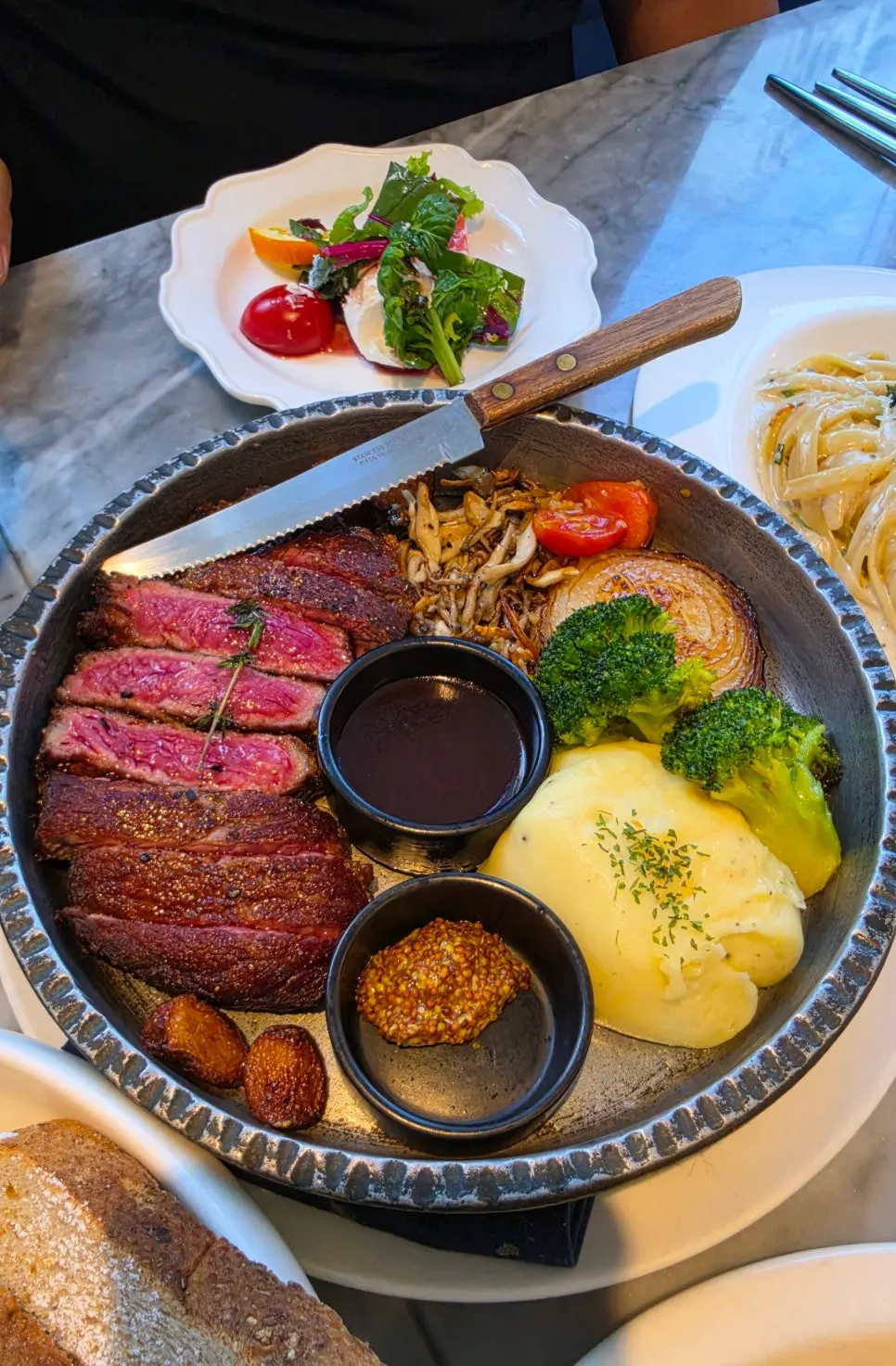 Prime striploin steak served on a cast-iron plate