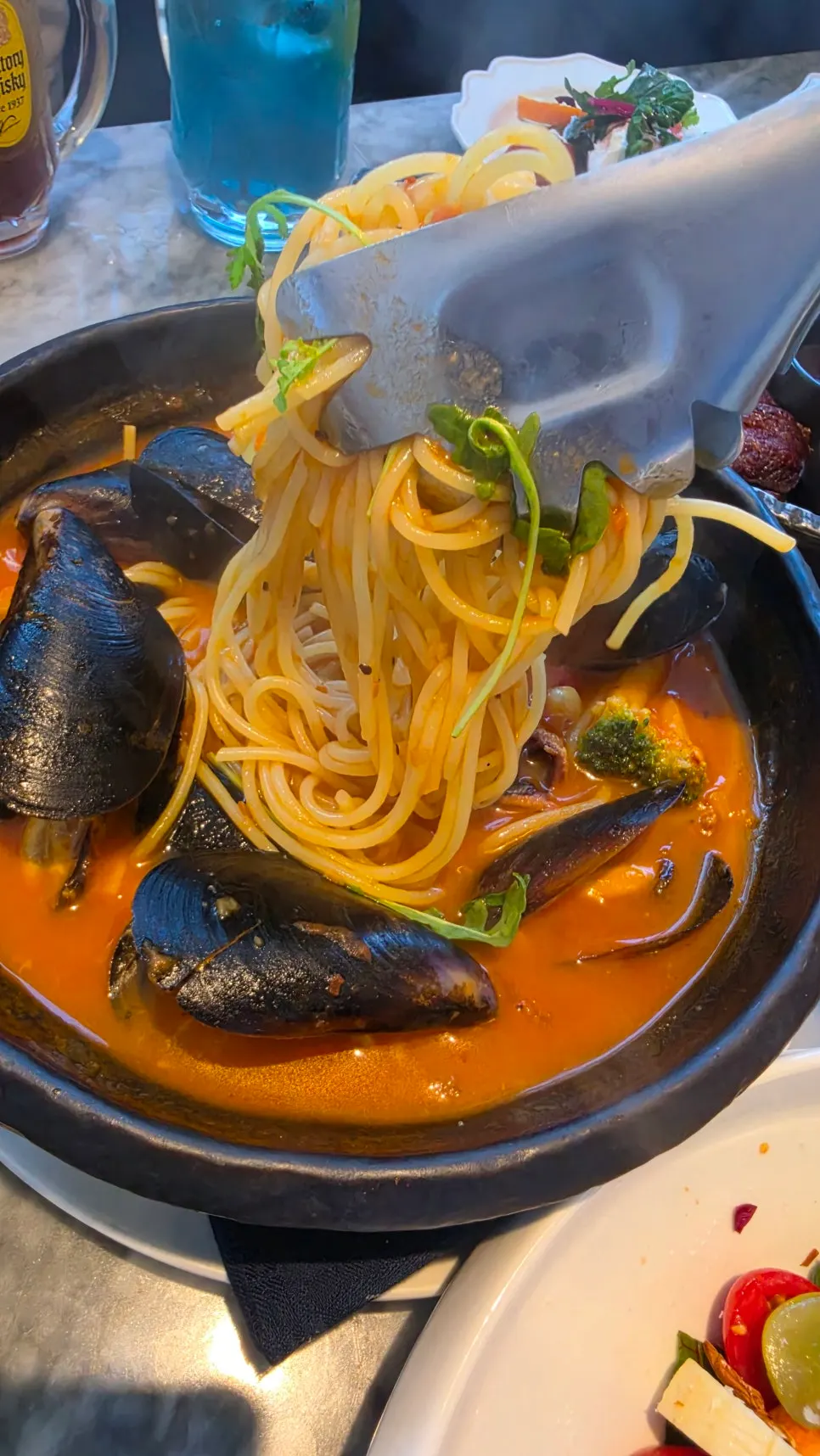 Spicy tomato broth with mussels and seafood