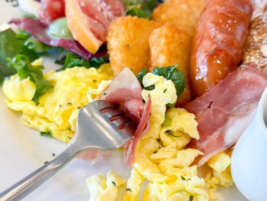 Signature pasta placed beside the brunch plate
