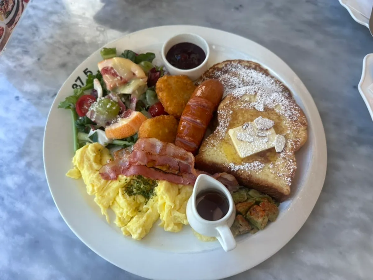 Table set with hearty classic American brunch and pasta