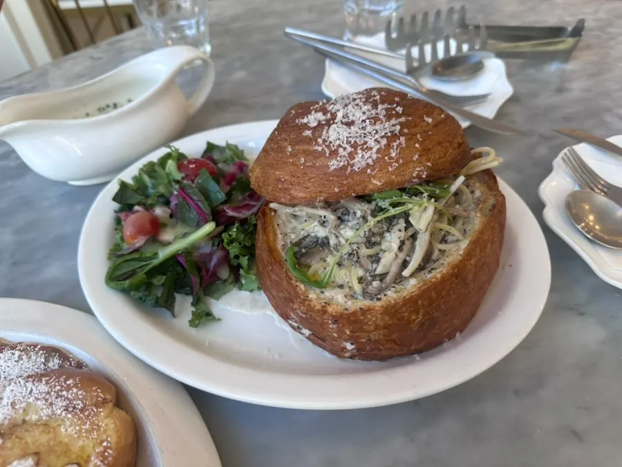 Truffle pasta served inside a Mont Blanc bread loaf