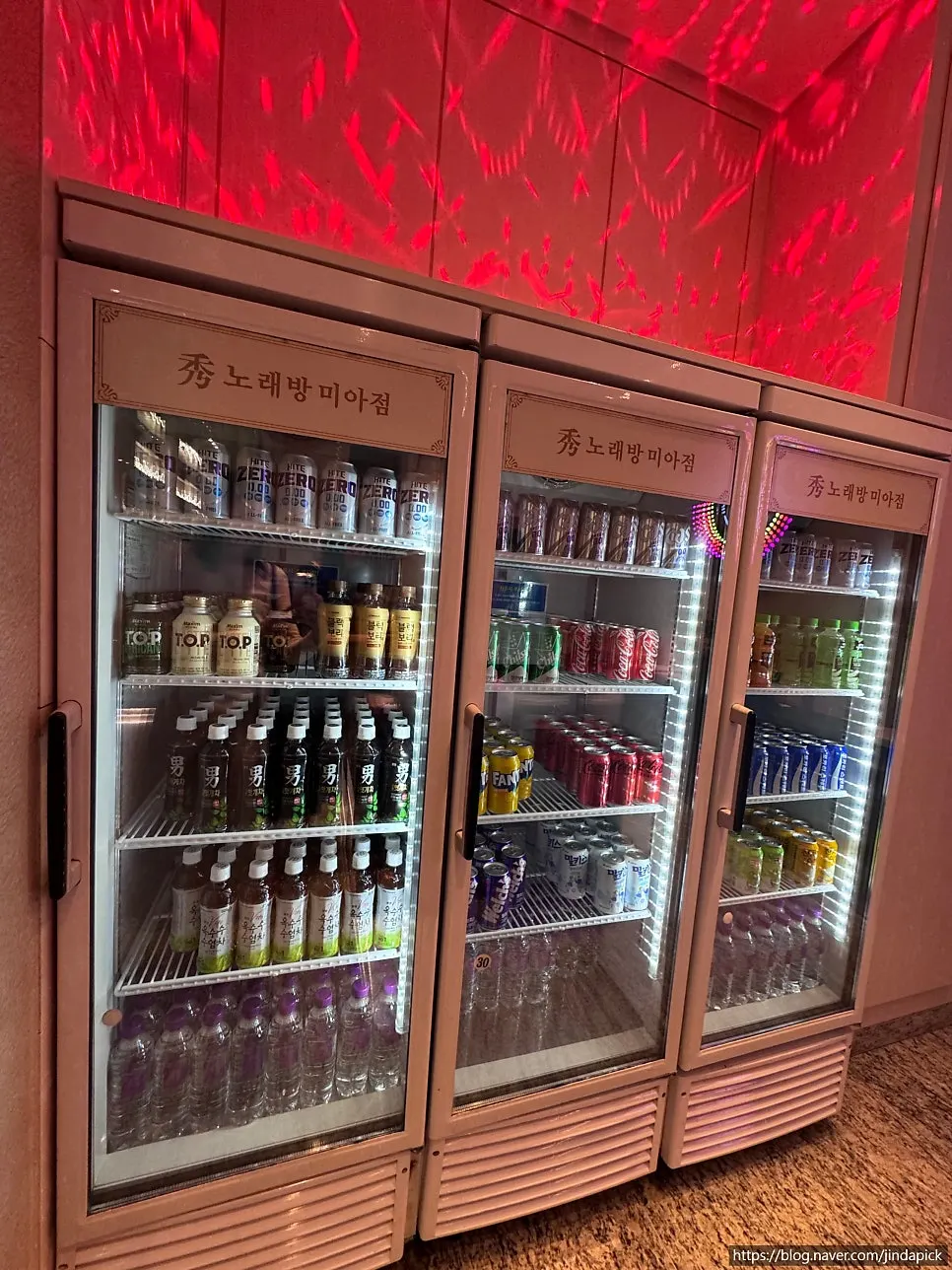 Drink refrigerator and menu beside the counter