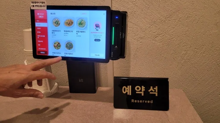 Tablet menu placed on a table at Midam Kitchen
