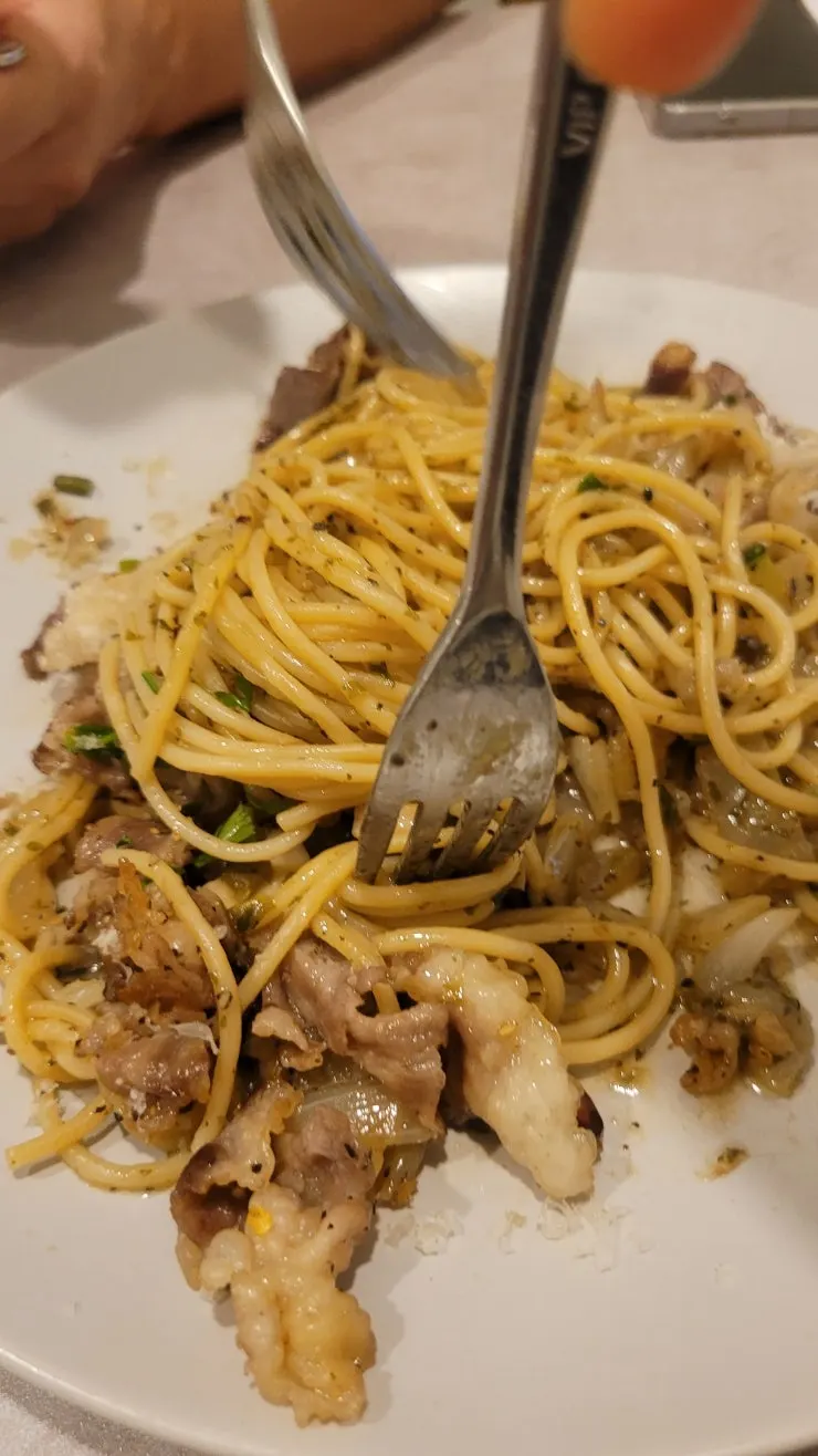 Beef brisket oil pasta topped with brisket and cheese powder