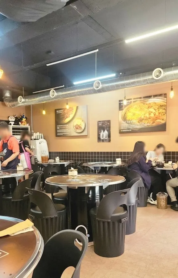 Indoor seating with a grill at the gopchang restaurant