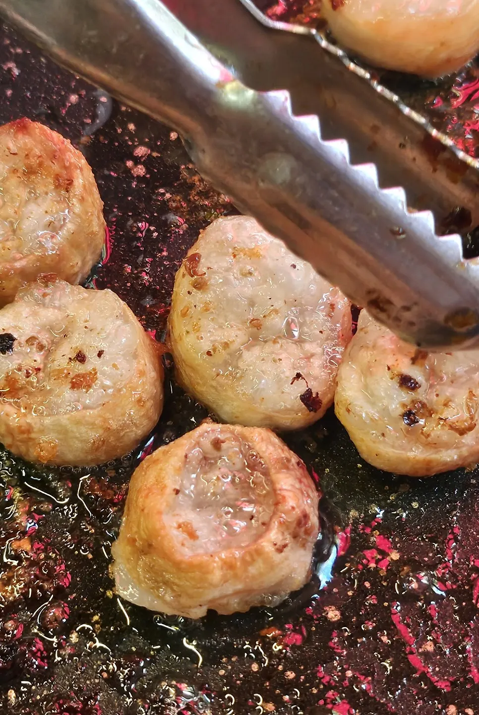 Gopchang dipped in the house plum sauce