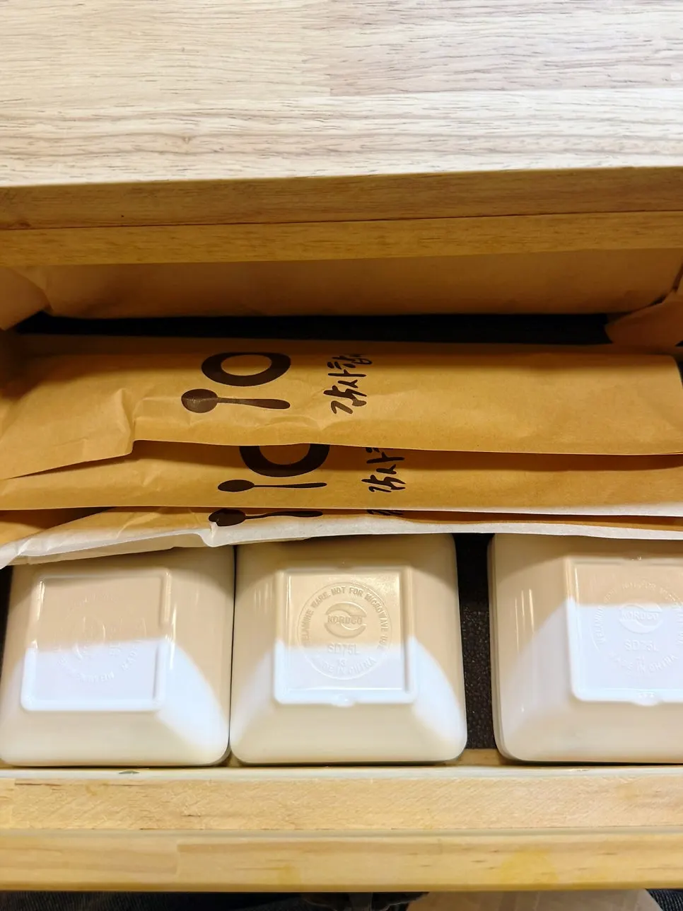 Chopsticks neatly arranged in the seat drawer