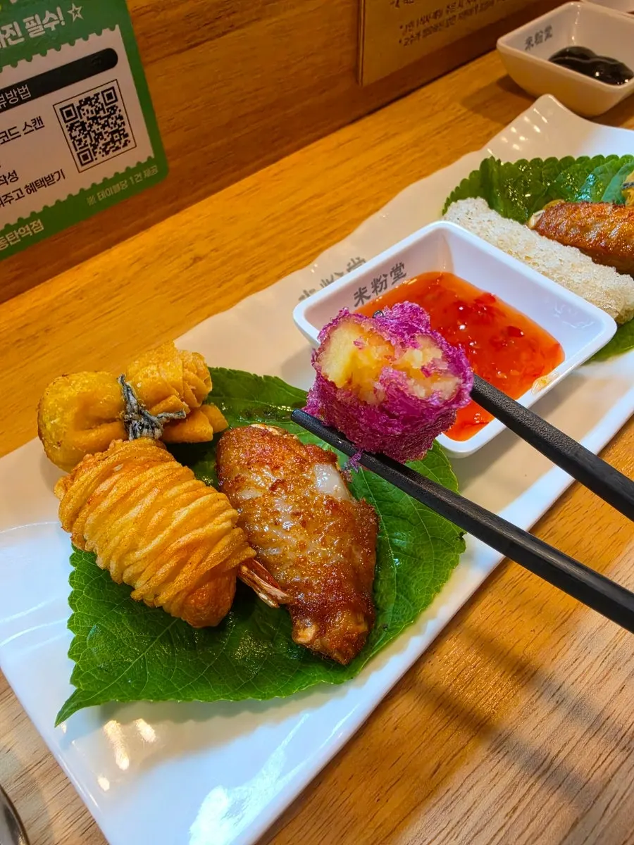A piece of fried shrimp potato roll