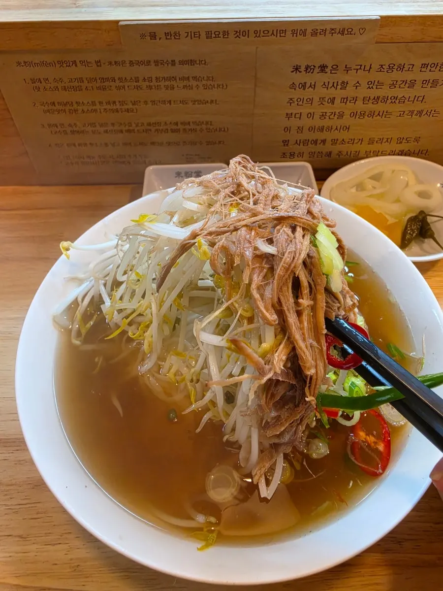 Two generously portioned bowls of pho