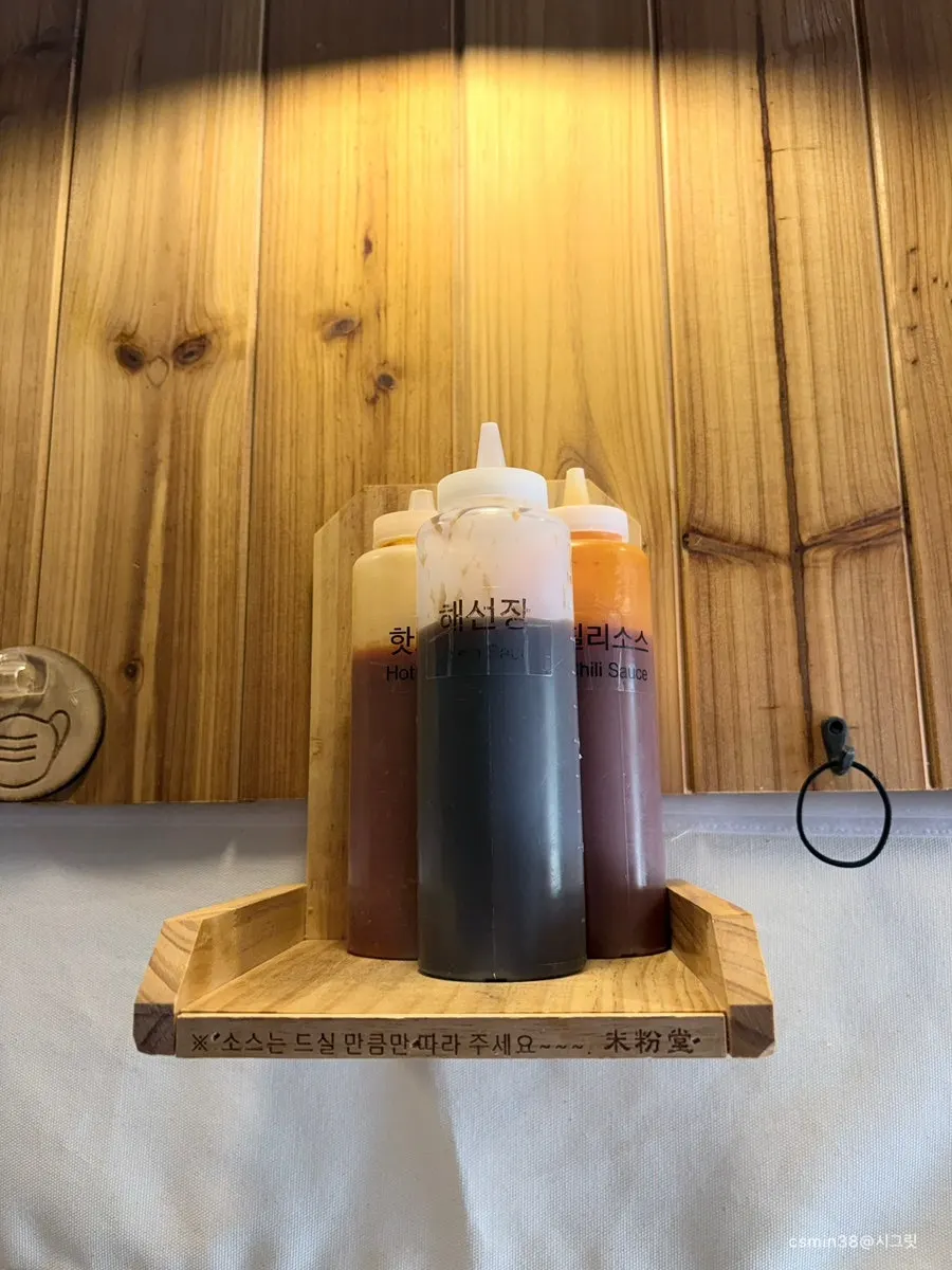 Sauces and a mask hook on the overhead shelf