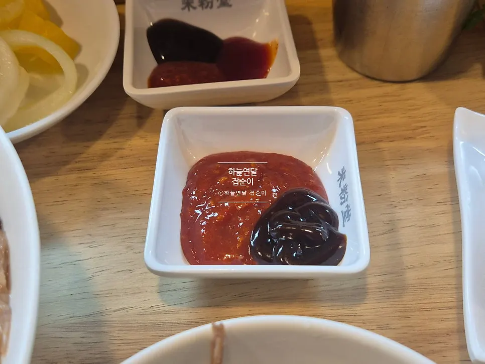Hot sauce, chili sauce, and hoisin sauce above the seat
