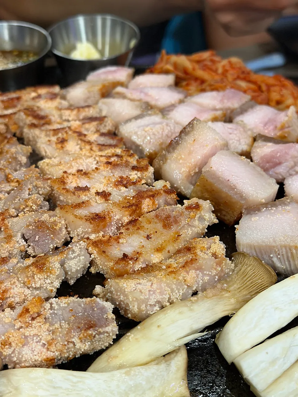 Meat being grilled tableside as part of the grilling service