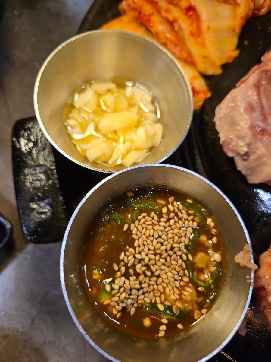Table setting with myeolchijeot and sesame garlic sauce