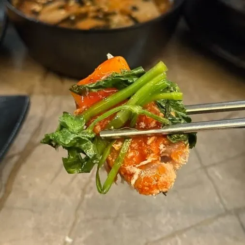 Breadcrumb-coated meat paired with green onion kimchi