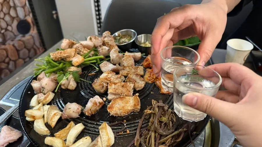 A drink paired with the pork belly