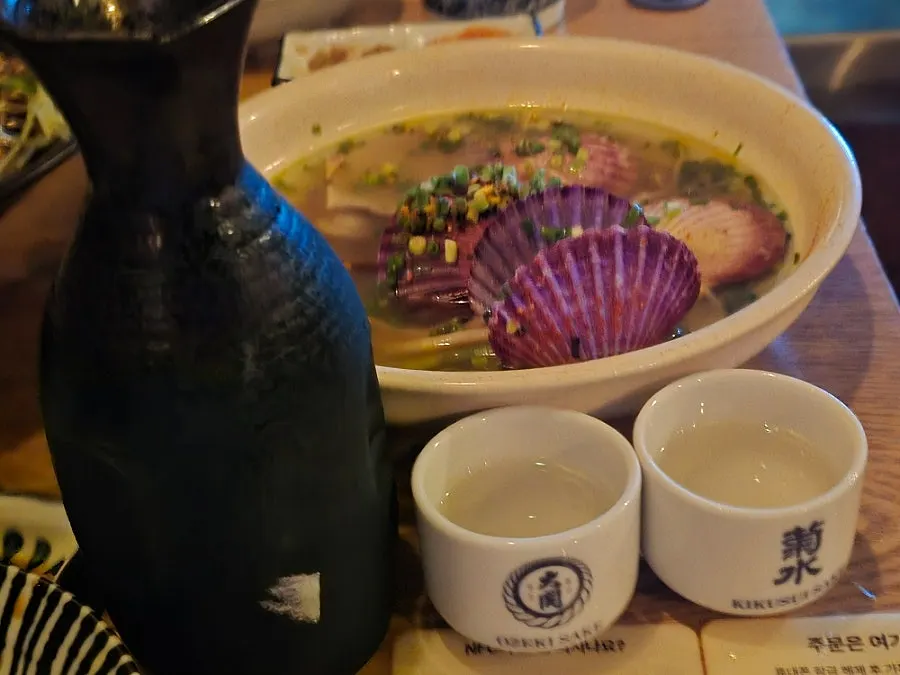 Sake-steamed scallop broth paired with sake