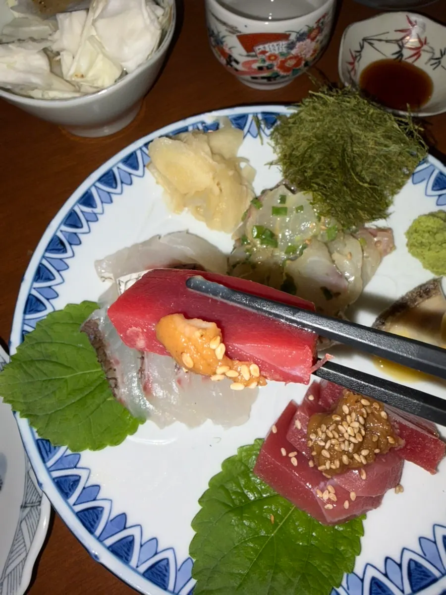 Sashimi plate with flounder salad, tuna, and abalone