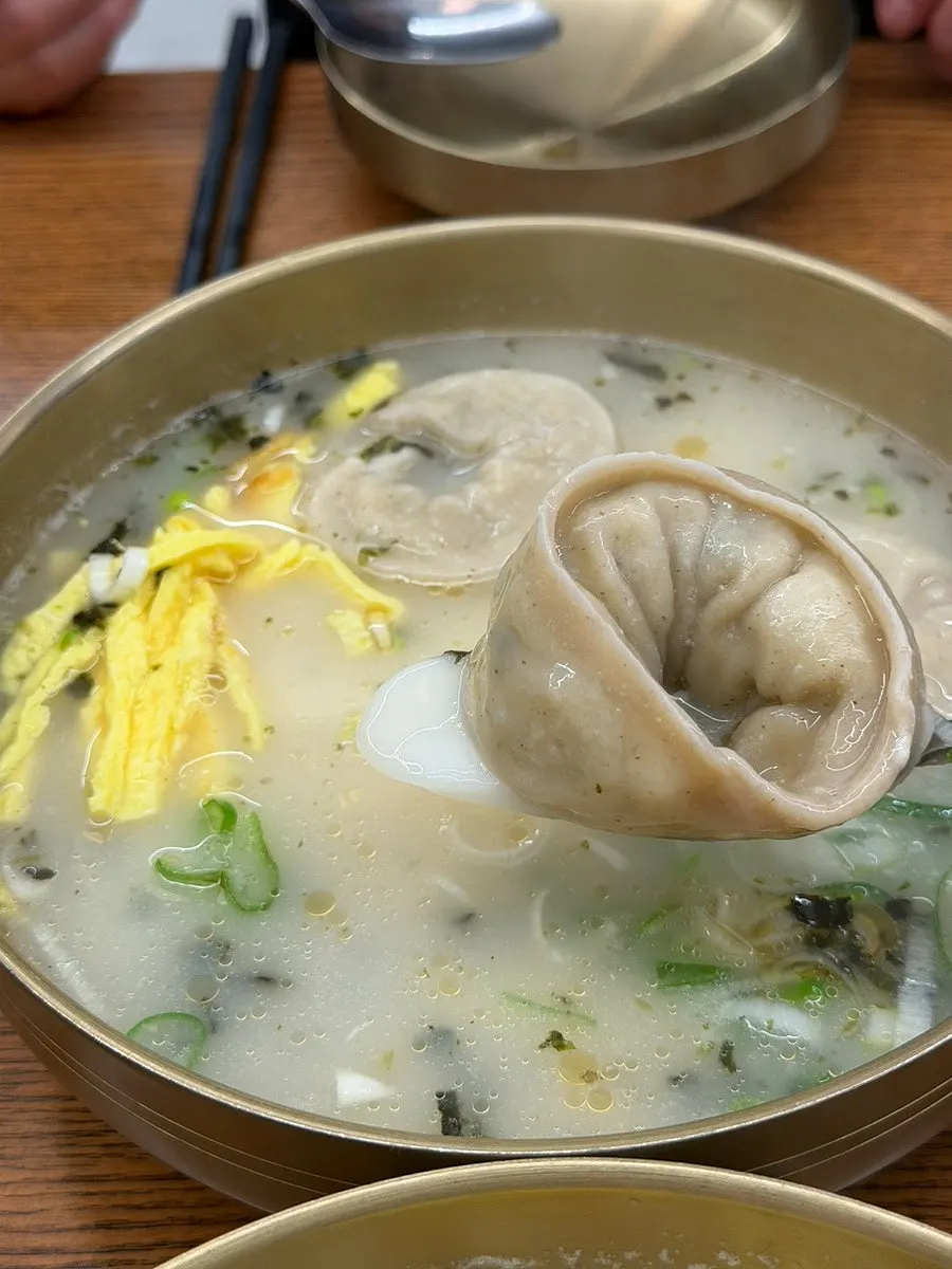 Tteok-mandu-guk loaded with rice cake and dumplings
