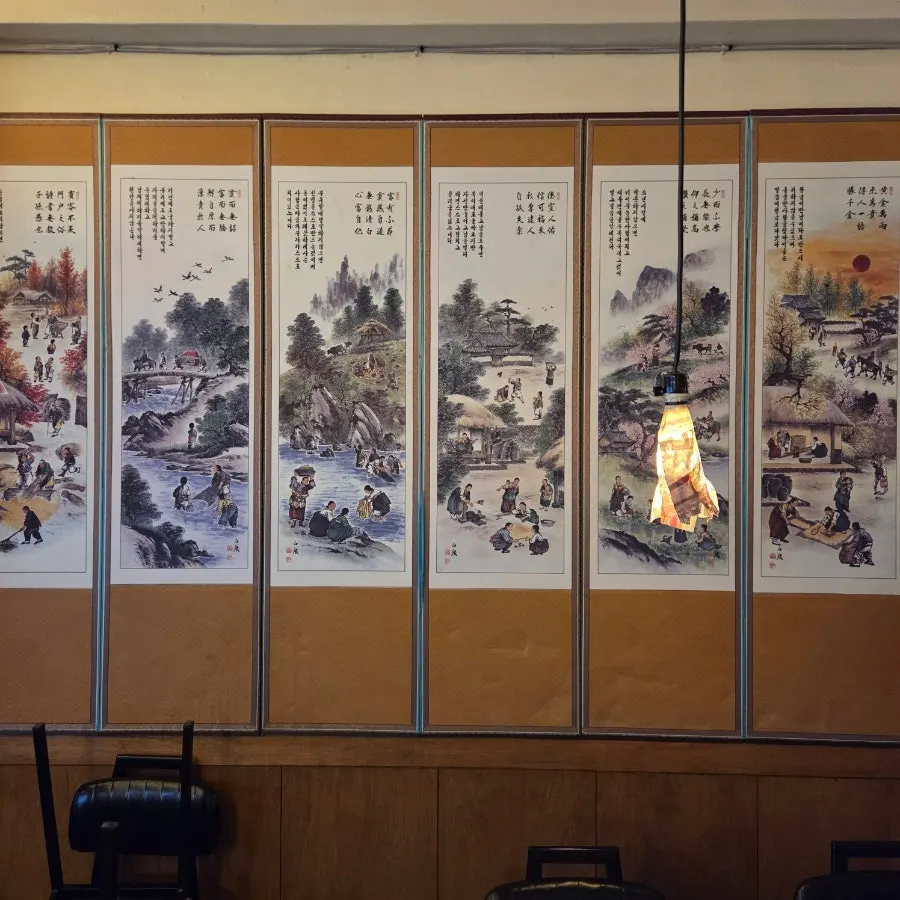 Dining hall seating with a folding screen at Mihyang Mungtigi
