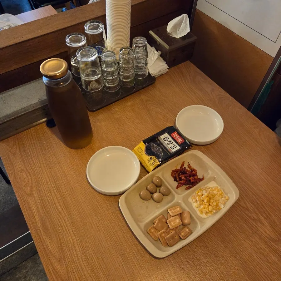 Covered base table setting with quail eggs and hardtack biscuits