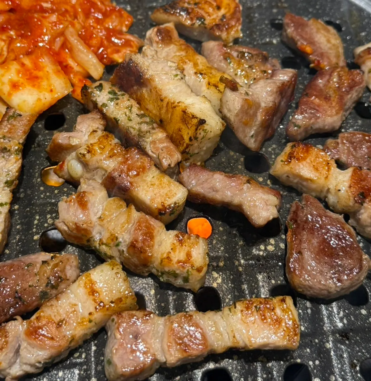 Fresh pork belly and Iberico pork collar grilling on the pan