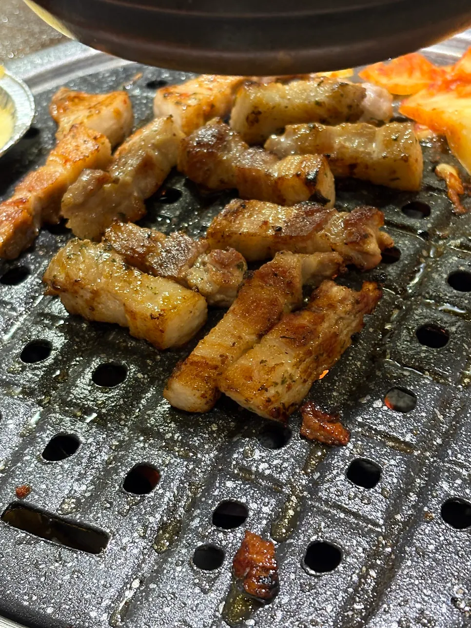 A piece of meat with ssamjang and scallion salad