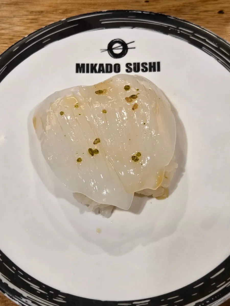 A plate of conveyor-belt sushi picked from the rail