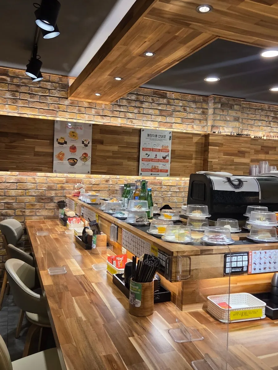 The long conveyor-belt sushi rail