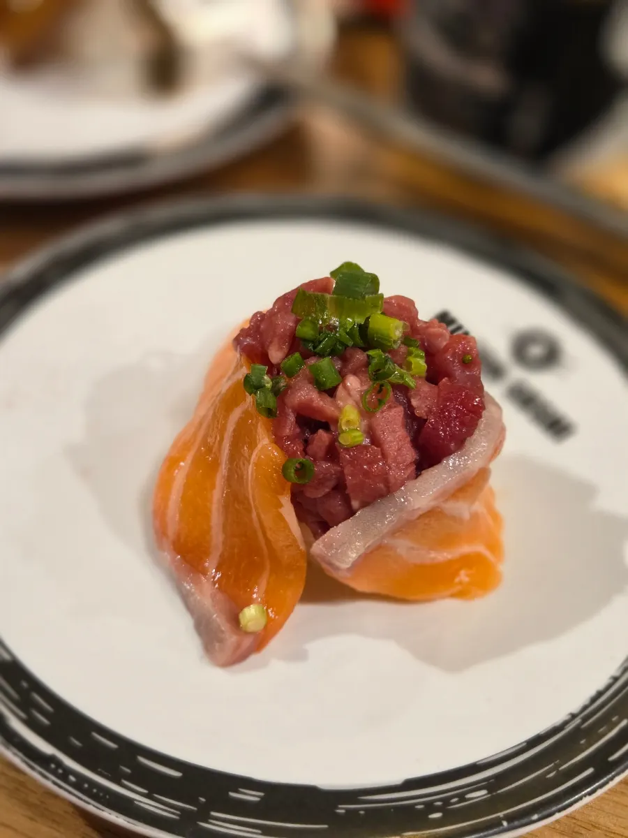 Beef tartare-salmon gunkan with salmon wrapping raw beef tartare