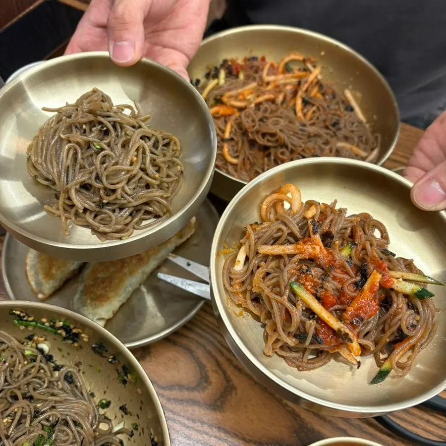 A meal of makguksu paired with fried dumplings