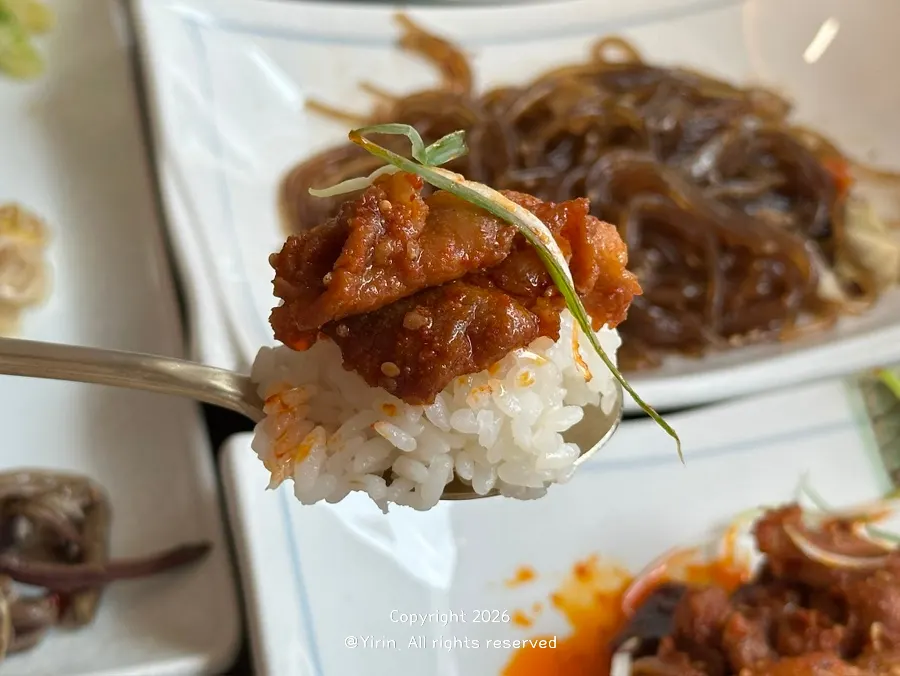 Warm stir-fried pork served at the table