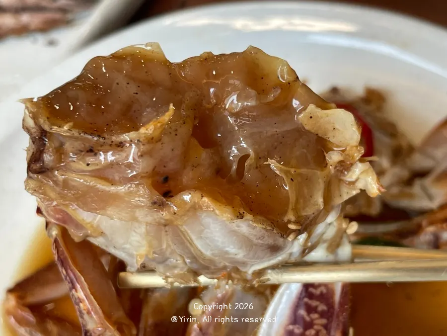 Soy-marinated crab eaten with rice
