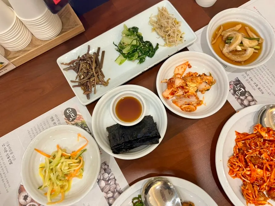 Side dishes including jellyfish cucumber salad and tricolor namul