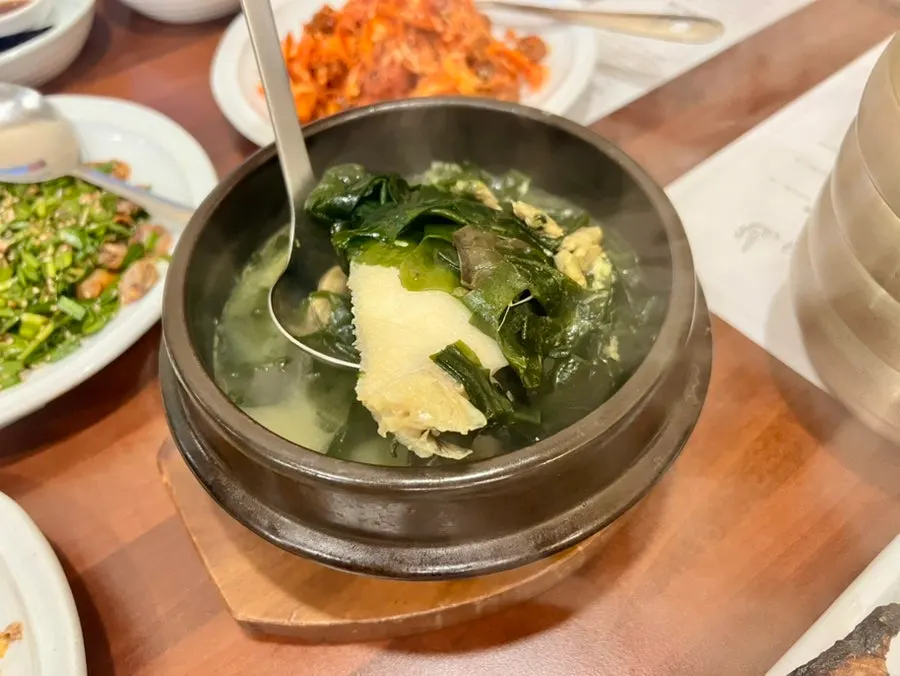 Seaweed soup with a whole flounder inside