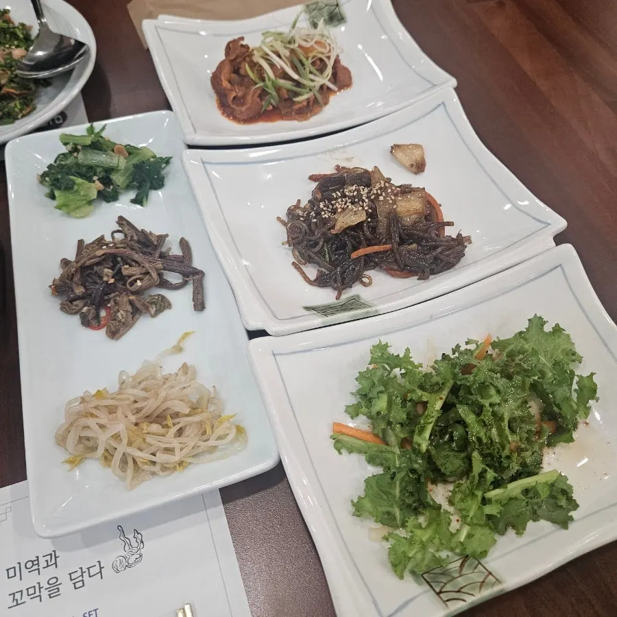 A generous spread of various side dishes set on the table