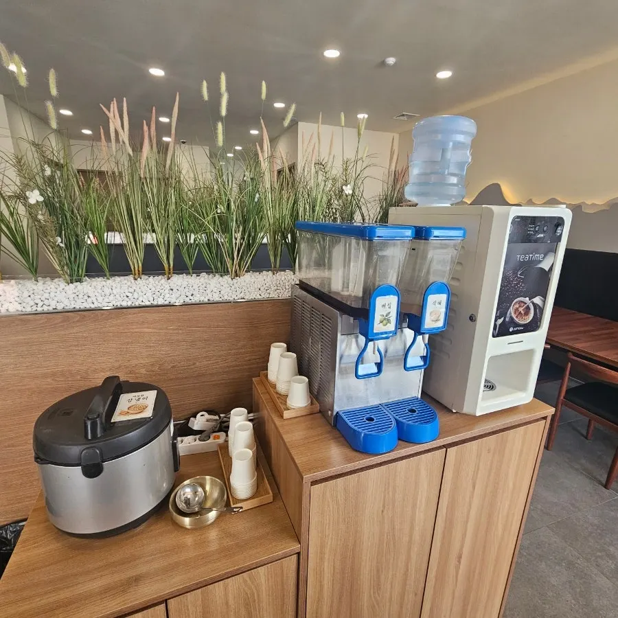 Dessert corner with roasted corn tea, plum tea, sikhye, and coffee