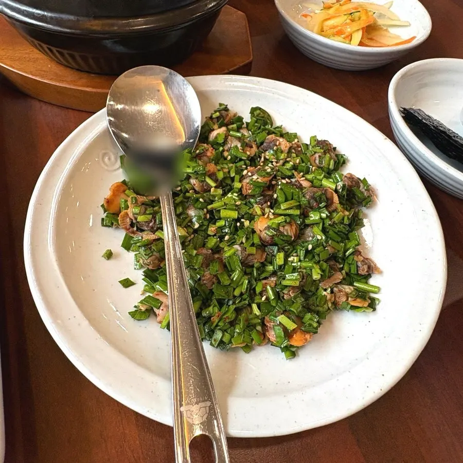 A bowl of soy sauce cockle bibim