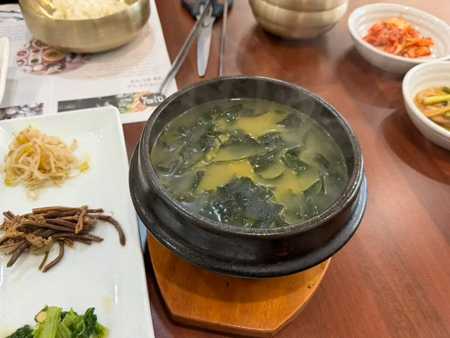 Side dishes including japchae and stir-fried pork